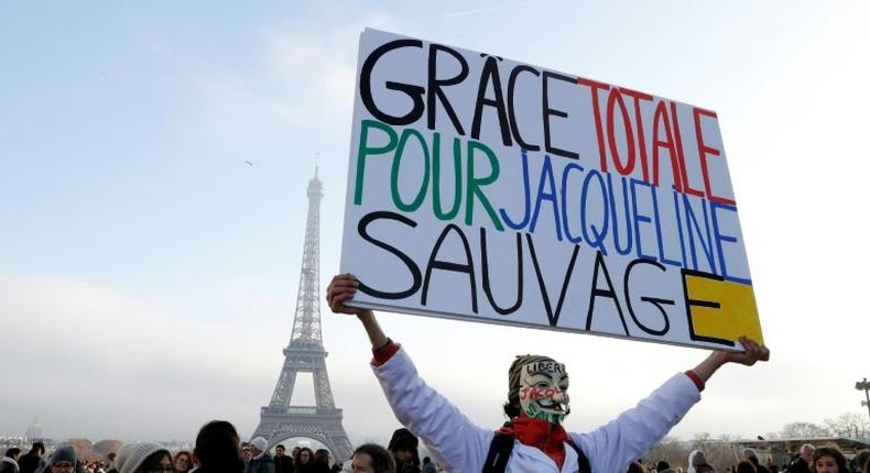 French protester Jean-Baptiste Redde calls for the release of Jacqueline Sauvage duing a rally at the Esplanade du Trocadero in Paris, on December 10, 2016