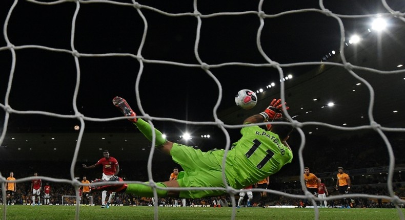 Wolves keeper Rui Patricio saves a penalty from Manchester United's Paul Pogba