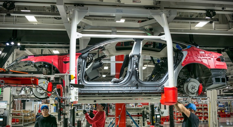 Workers at Tesla's Fremont factory.
