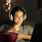 Woman watching online tv in the night