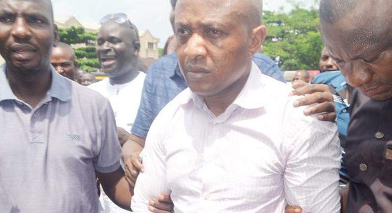 Kidnap kingpin, Evans being led by the police