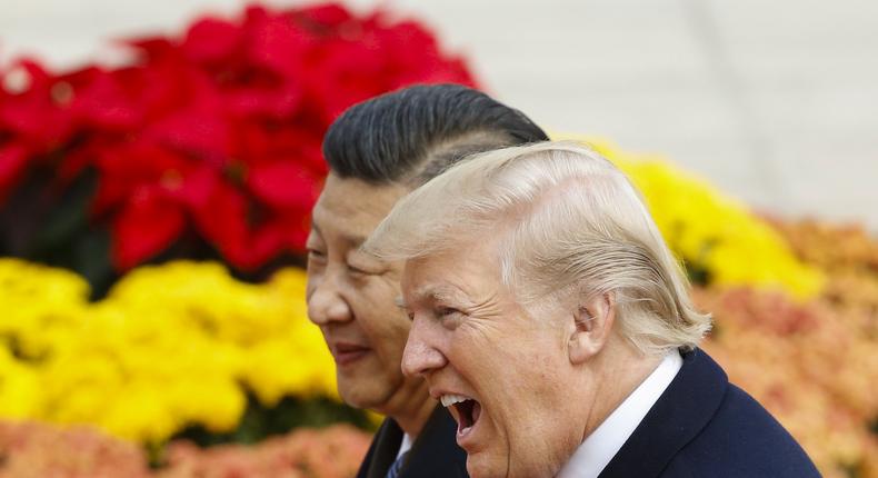 U.S. President Donald Trump takes part in a welcoming ceremony with China's President Xi Jinping on November 9, 2017 in Beijing, China. Trump is on a 10-day trip to Asia.