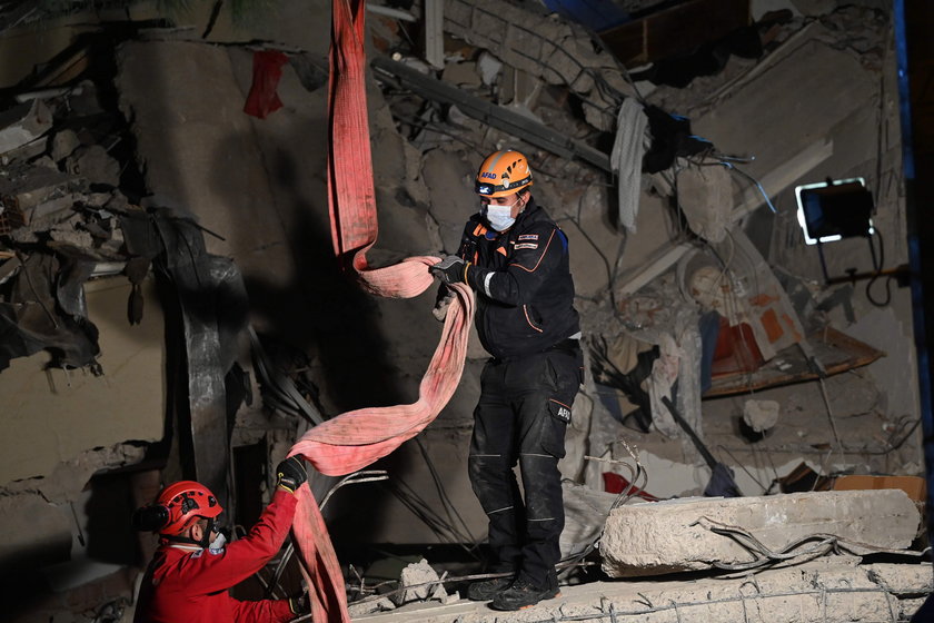 Rescue operations take place on a site after an earthquake struck the Aegean Sea, in the coastal pro