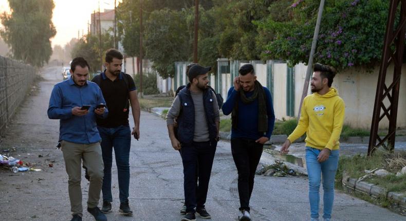 Young men in Iraq's second city Mosul ahead of performing a local adaption of famous Italian resistance song 'Bella Ciao'