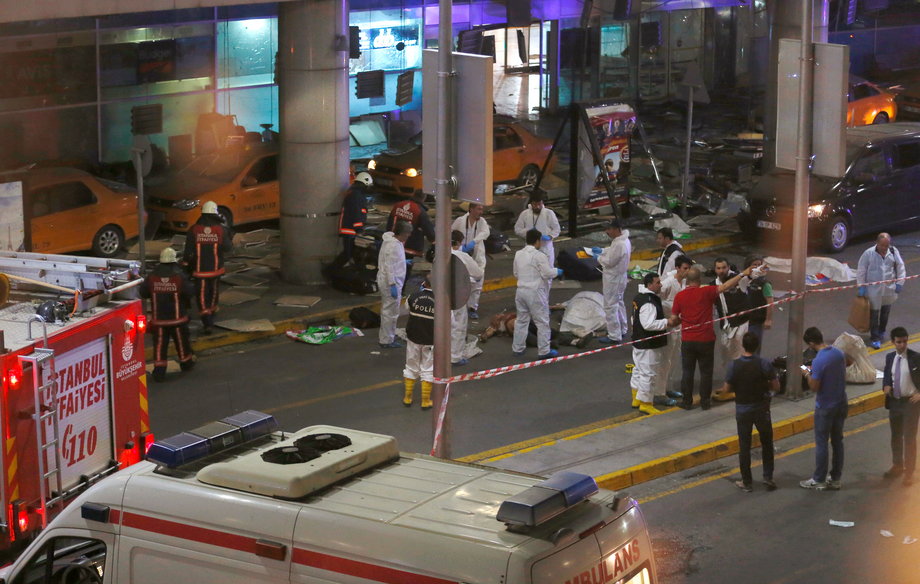 Forensic experts work outside Turkey's largest airport, Istanbul Ataturk, after a blast on June 28.