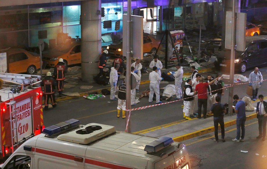 Forensic experts work outside Turkey's largest airport, Istanbul Ataturk, after a blast on June 28.