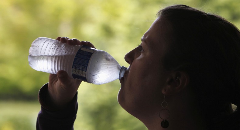 woman drinking bottled water.JPG