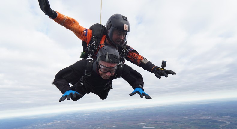 Al Blaschke (pictured in black) holds the Guinness World Records title for oldest person to tandem skydive.Guinness World Records