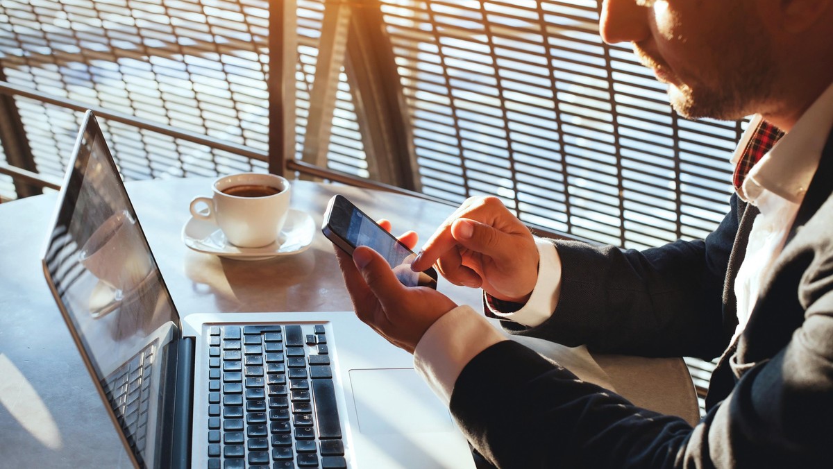 businessman checking email on smartphone