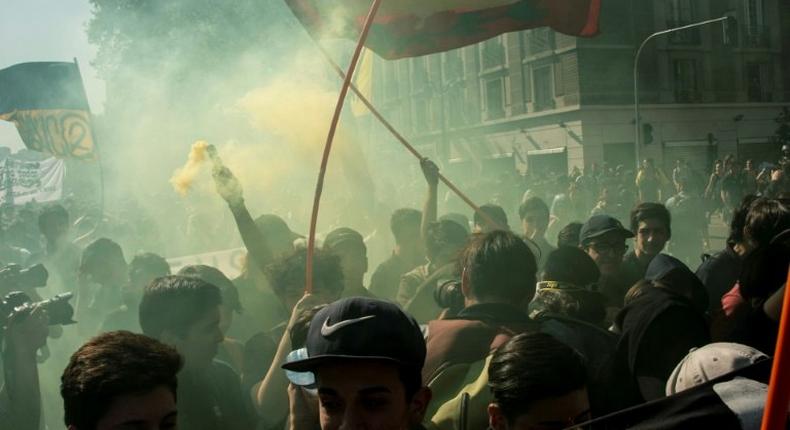 Students march to demand the government to speed up a long-awaited reform to guarantee universal access to free public education, in Santiago on April 11, 2017