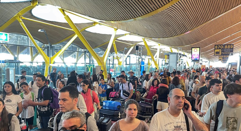 Passengers wait at Barajas Airport in Madrid following the IT outage on Friday.ELENA RODRIGUEZ/Reuters