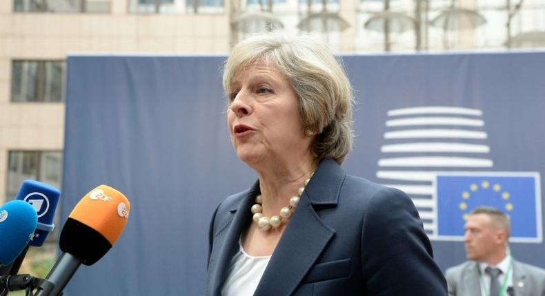 Britain's Prime Minister Theresa May speaks to reporters ahead of a European Union summit in Brussels, on October 20, 2016