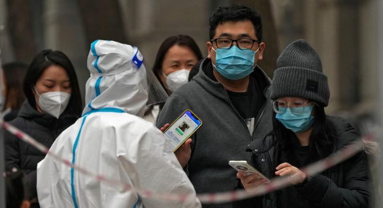 People lining up to get their routine COVID-19 throat swabs at a coronavirus testing site in Beijing, Thursday, November 24, 2022.AP Photo/Andy Wong, File