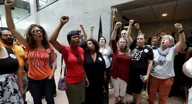 Protesters voice their opposition to U.S. President Donald Trump's Supreme Court nominee Brett Kavanaugh and their support for Dr. Christine Blasey Ford, the woman who has accused Kavanaugh of sexual assault, during a demonstration on Capitol Hill in Washington, U.S., September 20, 2018.