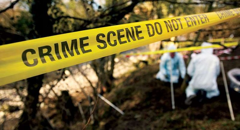 File image of detectives at a crime scene