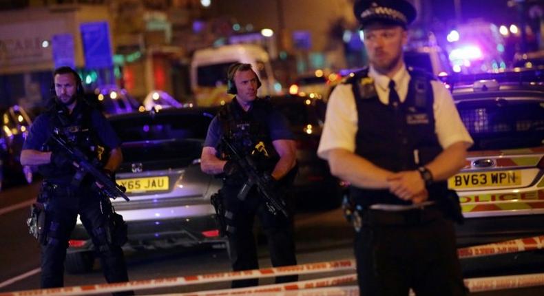 Police guard a street in the Finsbury Park area of north London where a vehicle hit pedestrians on June 19, 2017