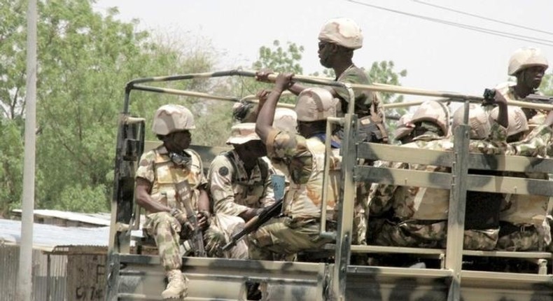 Soldiers are seen on a truck in Maiduguri in Borno State, Nigeria May 14, 2015. REUTERS/Stringer