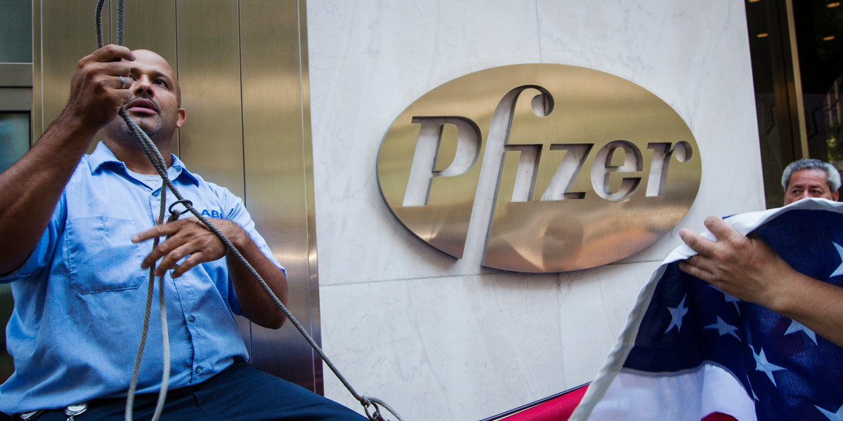 Workers outside the Pfizer building in New York in 2013.