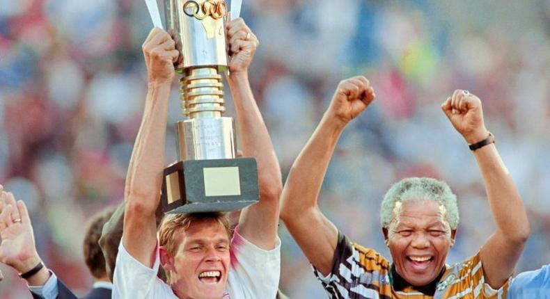 South African football legend and current national technical director of football, Neil Tovey, pictured after 1996 Africa Cup of Nations win with then-President Nelson Mandela, had a previous heart health scare while playing squash in 2015