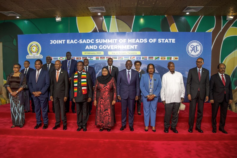 Heads of state from the Southern African Development Community (SADC) and the East African Community (EAC) pose for a group photo before attending the Extraordinary Joint Regional Summit at the State House in Dar es Salaam on February 8, 2025. [Photo by ERICKY BONIPHACE/AFP via Getty Images]