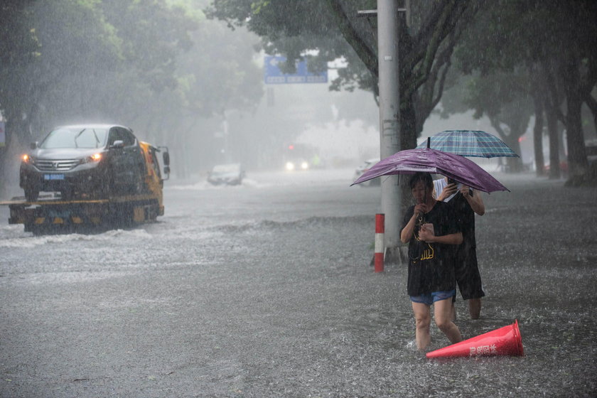 Cars are partially submerged in floodwaters after Typhoon Lekima hit Dajing town in Wenzhou, Zhejian