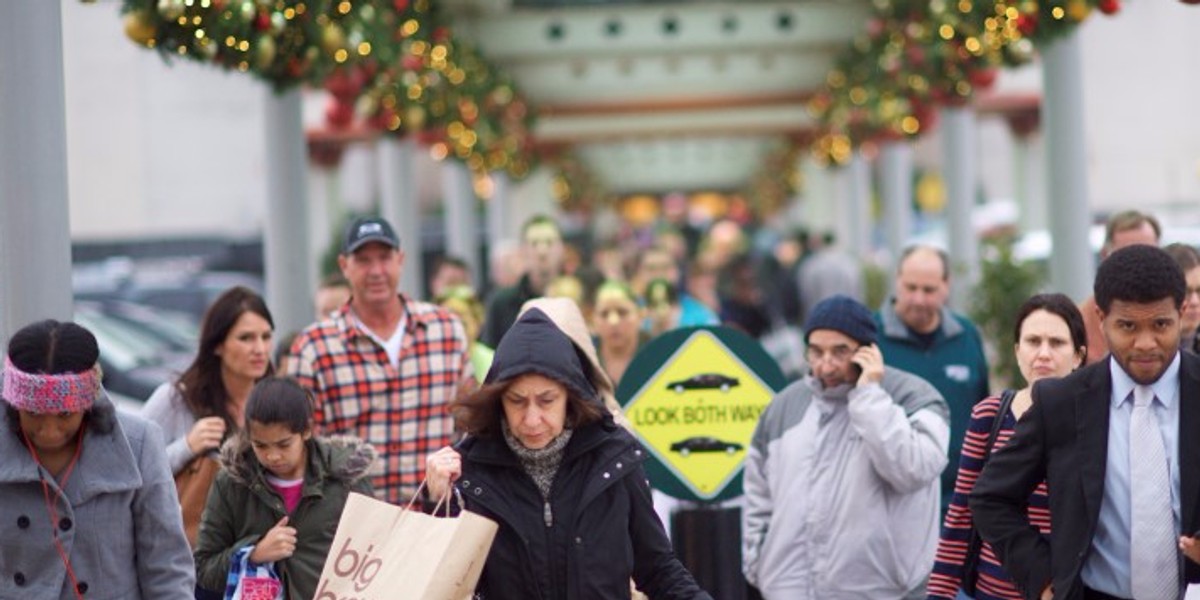 Shoppers walk a connecting path from The Court to The Plaza at the King of Prussia Mall, United State's largest retail shopping space, in King of Prussia, Pennsylvania on December 6, 2014.