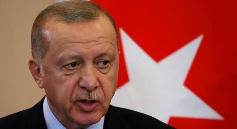 Turkish President Recep Tayyip Erdogan says he will clear terrorists from the border between Turkey and northern Syria if Syrian Kurdish militia don't withdraw by Tuesday