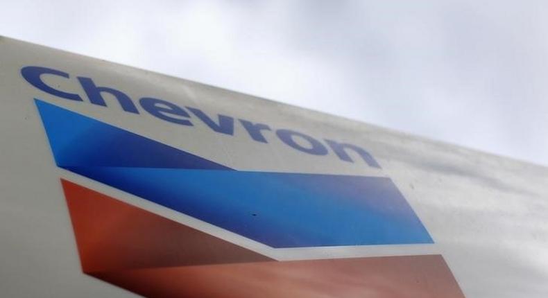 A Chevron gas station sign is pictured at one of their retain gas stations in Cardiff, California October 9, 2013. REUTERS/Mike Blake