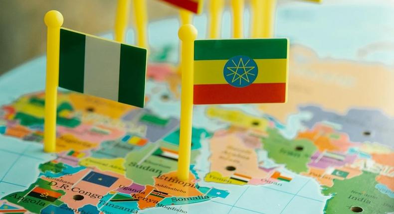 Toy flags pinned on world map [Image Credit: Lara Jameson]