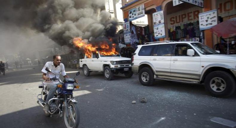 Protesters vow to derail Haiti presidential vote; election offices burned