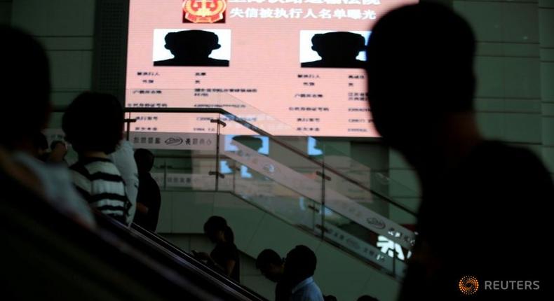 Shame on you! China uses public billboards to expose runaway debtors