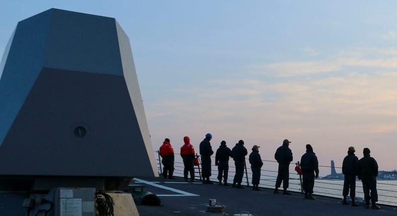 US Navy sailors man the rails aboard Arleigh Burke-class guided-missile destroyer USS Forrest Sherman in Kiel, Germany, March 21, 2022.