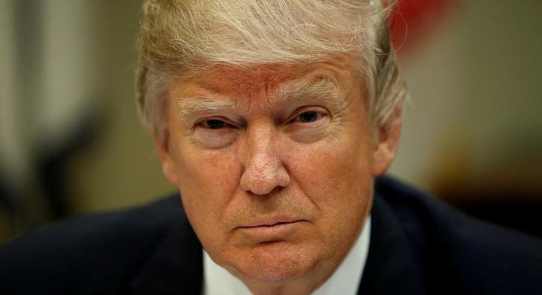 U.S. President Donald Trump looks up while hosting a House and Senate leadership lunch at the White House in Washington