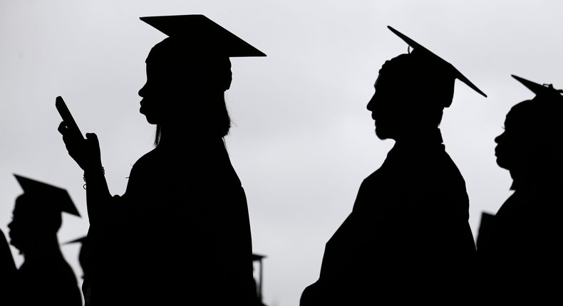 In this May 17, 2018, file photo, new graduates line up before the start of the Bergen Community College commencement at MetLife Stadium in East Rutherford, N.J.
