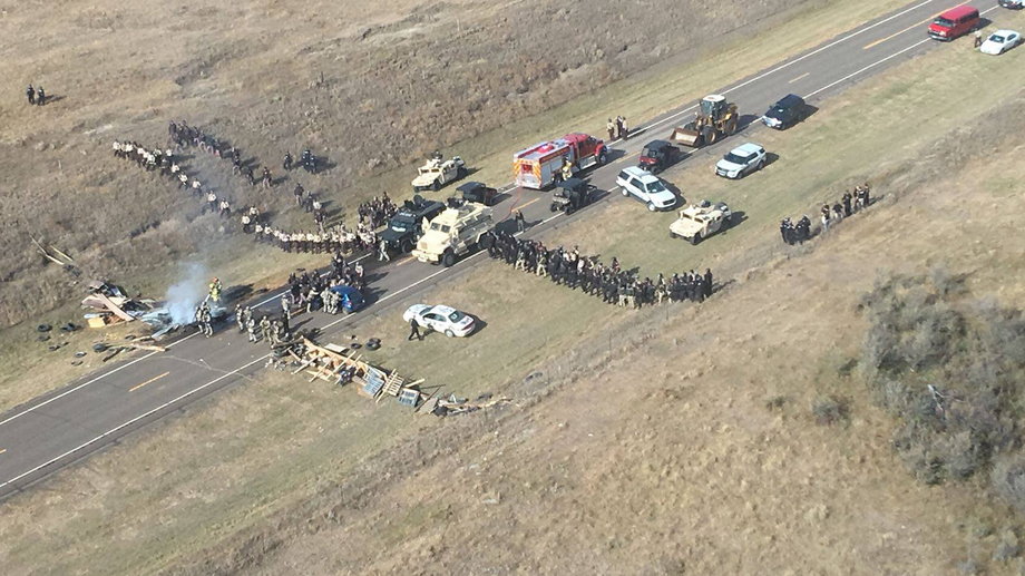 Protesters against the Dakota Access Pipeline stood off with police officers in this aerial photo of Highway 1806 and County Road 134 near the town of Cannon Ball, North Dakota, on Thursday.