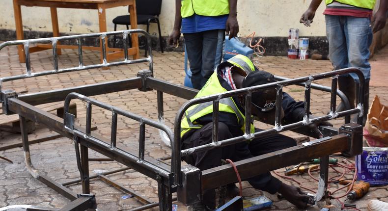 Welders in Githunguri work on local ICU bed innovation by Mungai Gathogo and Joseph Muhinja