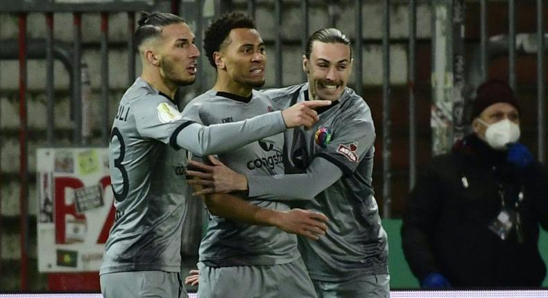 St Pauli forward Etienne Amenyido (C) celebrates scoring against Dortmund inn the German Cup Creator: FABIAN BIMMER