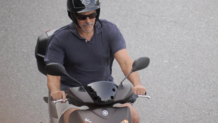 EXCLUSIVE: George Clooney takes a relaxing scooter ride around Lake Como, leaving wife Amal at home 