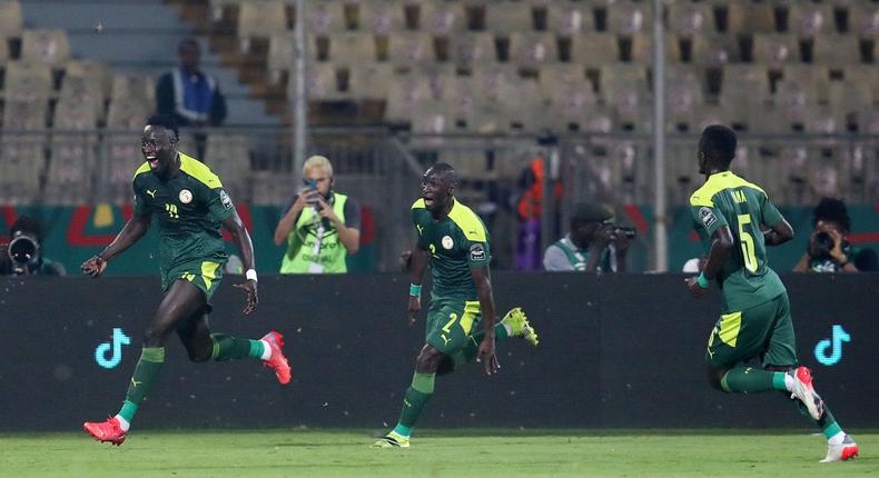 Famara Diedhiou celebrates wildly after scoring the opener against Equatorial Guinea.