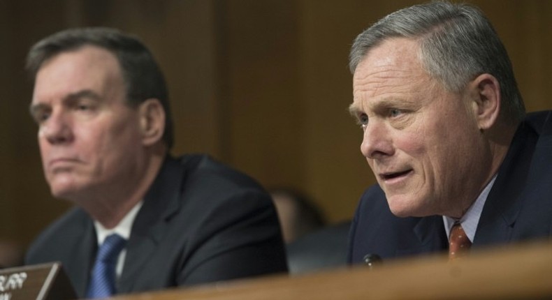 Senators Mark Warner (L) and Richard Burr -- chair of the Senate Select Committee on Intelligence -- promised a thorough investigation of Russian meddling in the presidential election at a hearing on Thursday