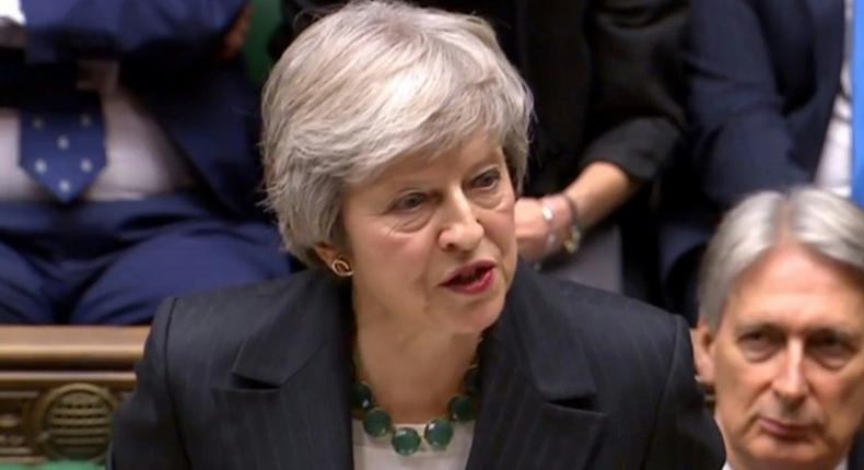 Theresa May battled to defend her draft Brexit deal before a hostile parliament