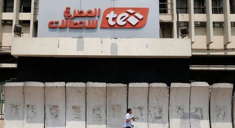 A man walks in front of the main Telecom Egypt building at the center of downtown in Cairo, Egypt August 16, 2016.  REUTERS/Amr Abdallah Dalsh