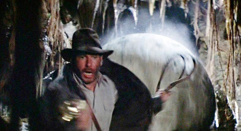 A scene from Indiana Jones and the Raiders of the Lost Ark, in which the character has to run away from a boulder triggered by a booby trap.CBS via Getty Images