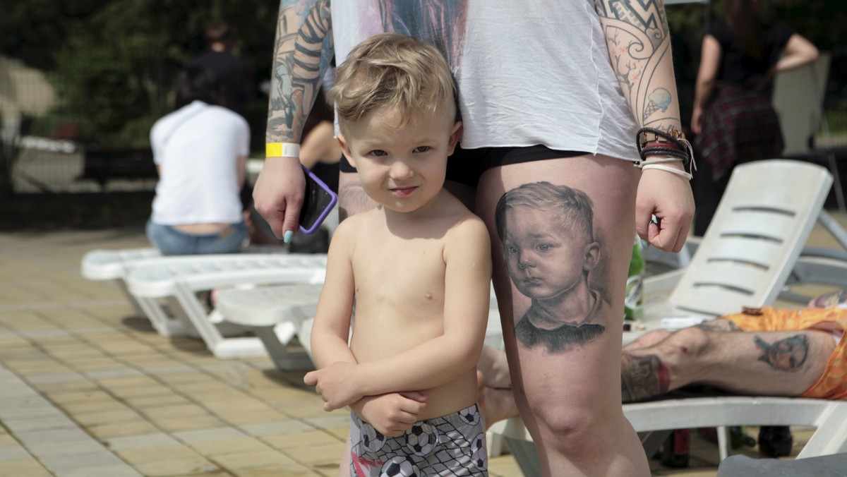 Woman with child attends International Tattoo Festival in Sochi