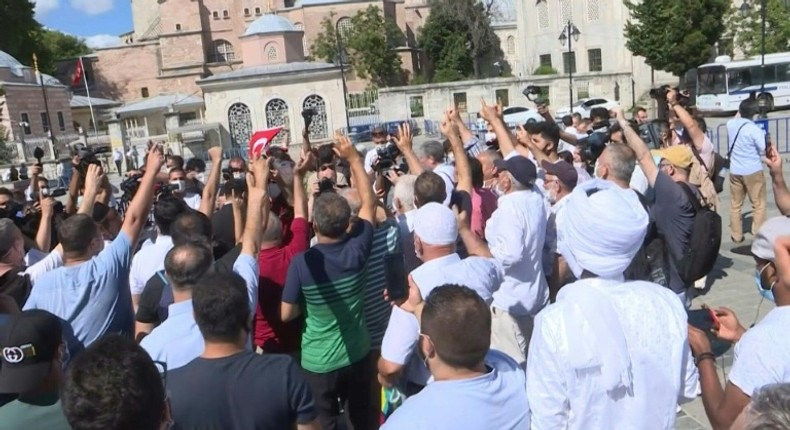 In Istanbul, people celebrate the decision of a top Turkish court to revoke the sixth-century Hagia Sophia's status as a museum, clearing the way for the Istanbul landmark to be turned back into a mosque in a move backed by President Recep Tayyip Erdogan.