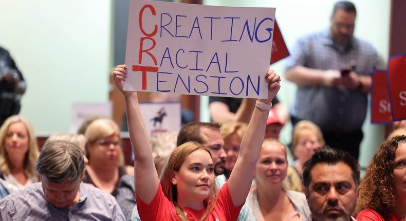 Opponents of an academic doctrine known as critical race theory attend a packed Loudoun County, Virginia school board meeting.
