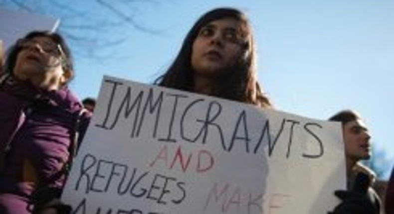 People protest outside the White House on February 4, 2017