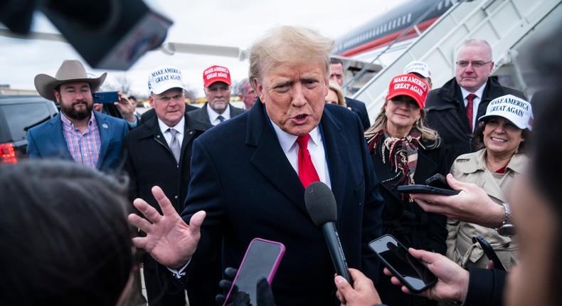 Former President Donald Trump speaks with reporters as he lands at Quad City International Airport en route to Iowa on Monday, March 13, 2023.Jabin Botsford/The Washington Post via Getty Images