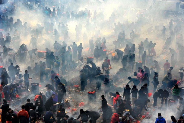 People burn incense to worship the God of Fortune at Guiyuan Temple on the fifth day of Chinese Luna