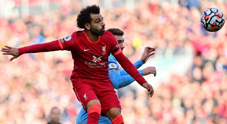 Egypt star Mohamed Salah (L) wins a heading duel during the Premier League draw between Liverpool and Manchester City at the weekend. Creator: Paul ELLIS